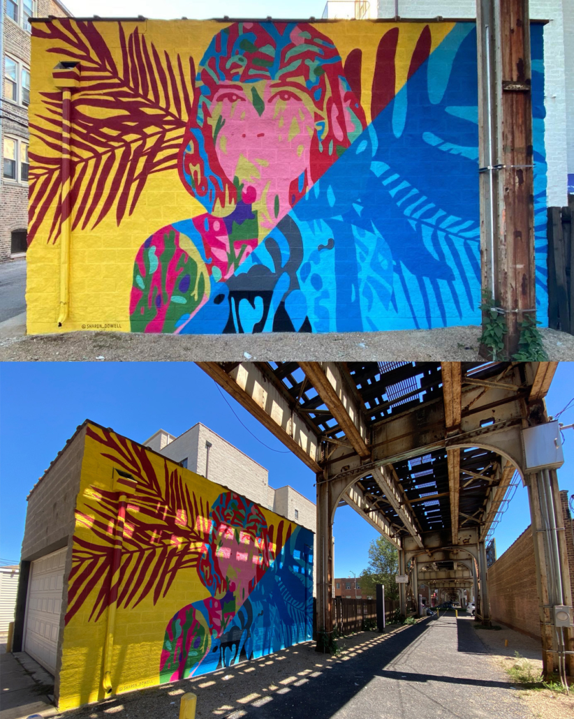 15” h x 24’ w mural on exterior concrete wall of woman painted in vibrant colors with shoulder-length hair facing forward, looking outward. Mural bisected diagonally: yellow background with maroon palm fronds on left side, right side blocked in all blues. In shadows of Ashland Ave L Train bridge, Lakeview Chicago.